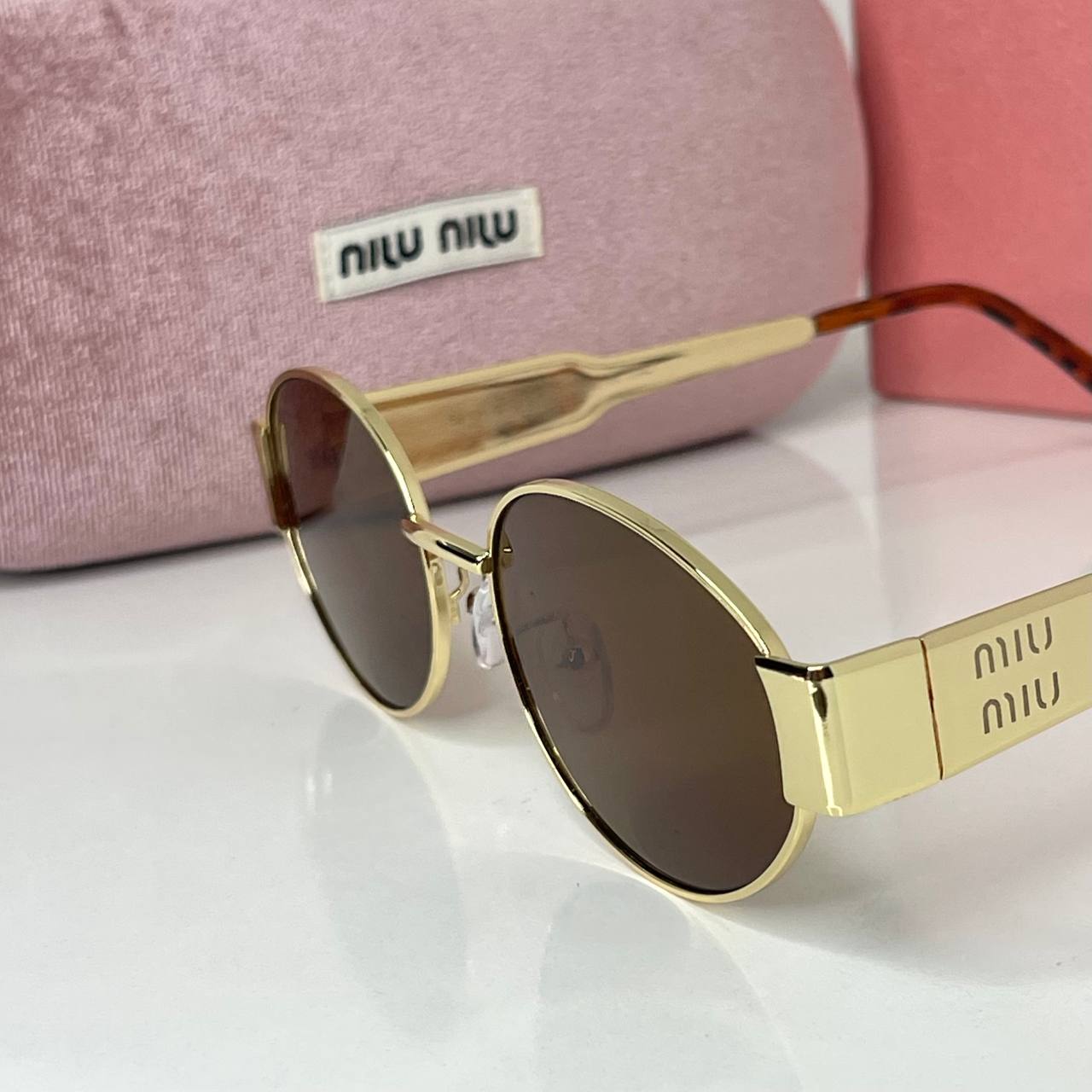 Miu Miu Vision Gold