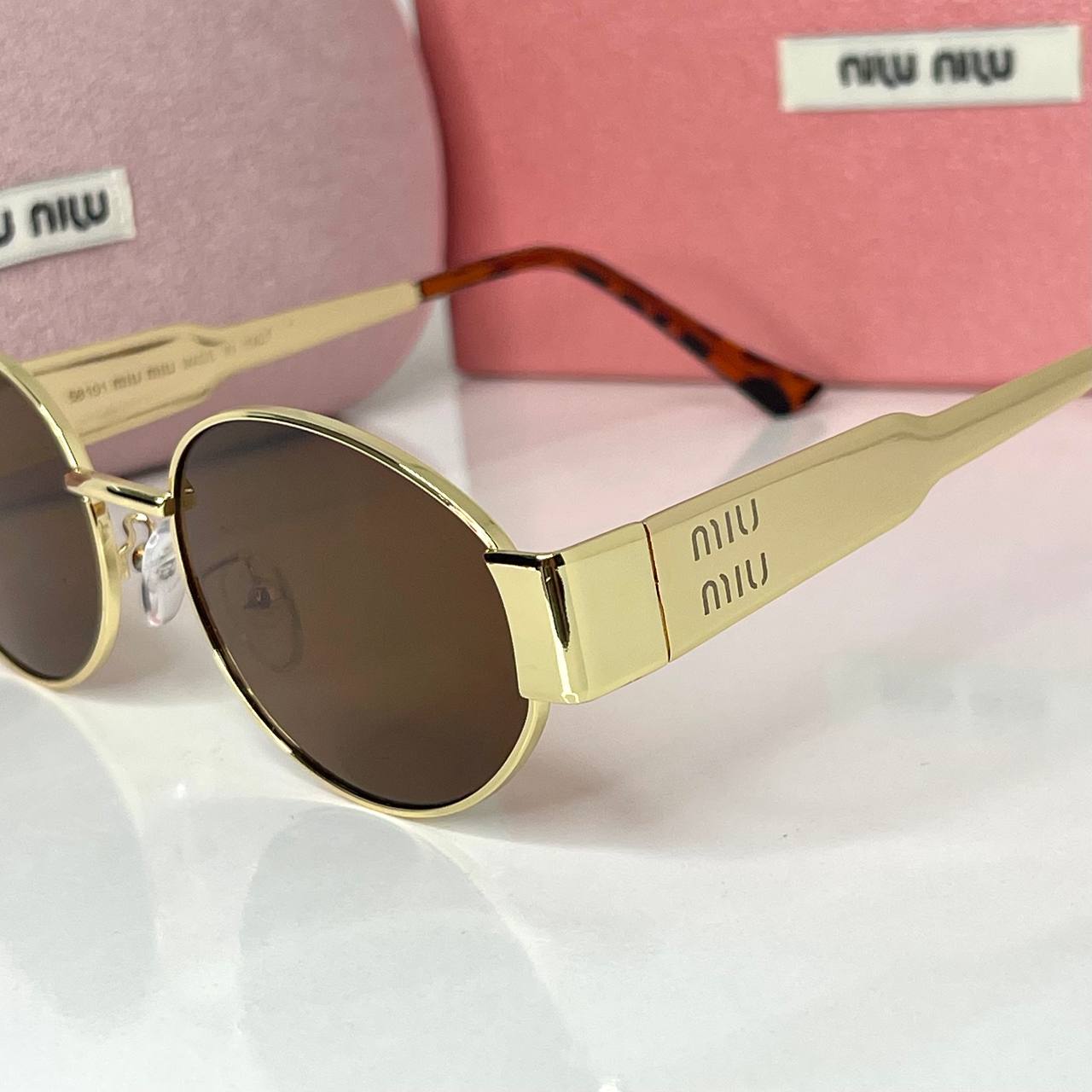 Miu Miu Vision Gold