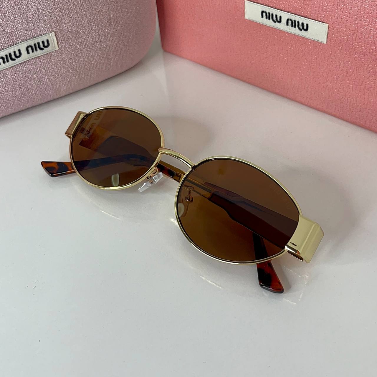 Miu Miu Vision Gold